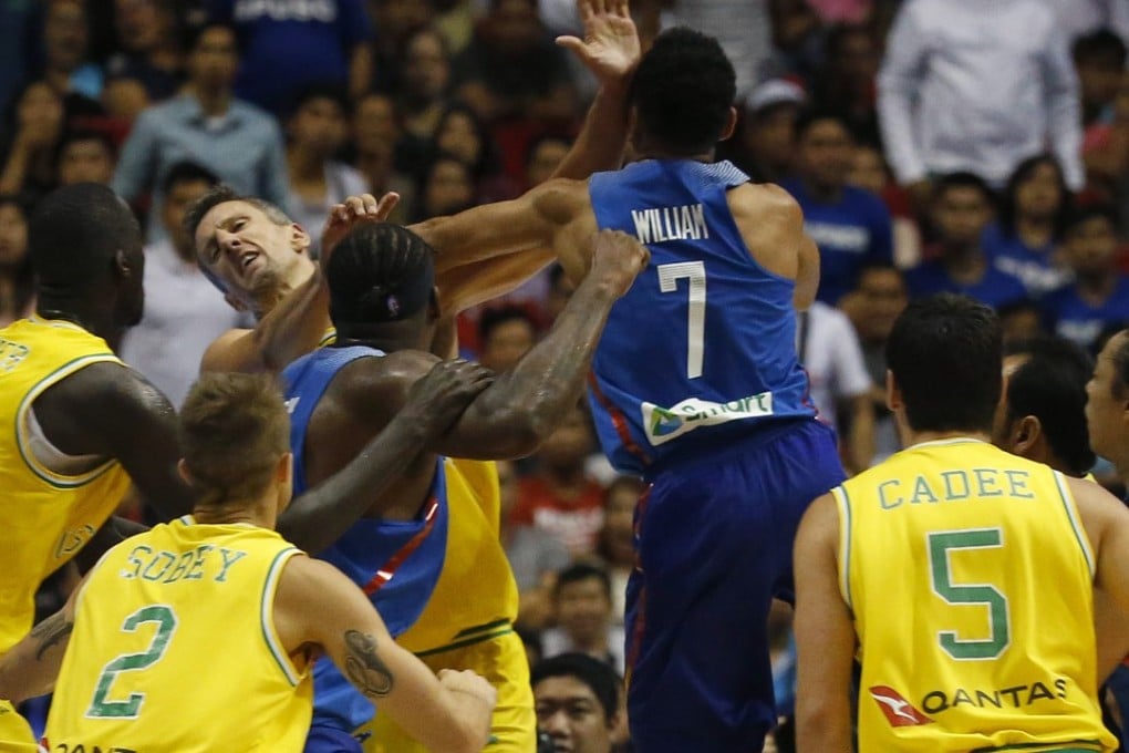 Philippines’ Jason William strikes Australia’s Daniel Kickert as others rush over to get involved in a mass brawl. Photo: AP