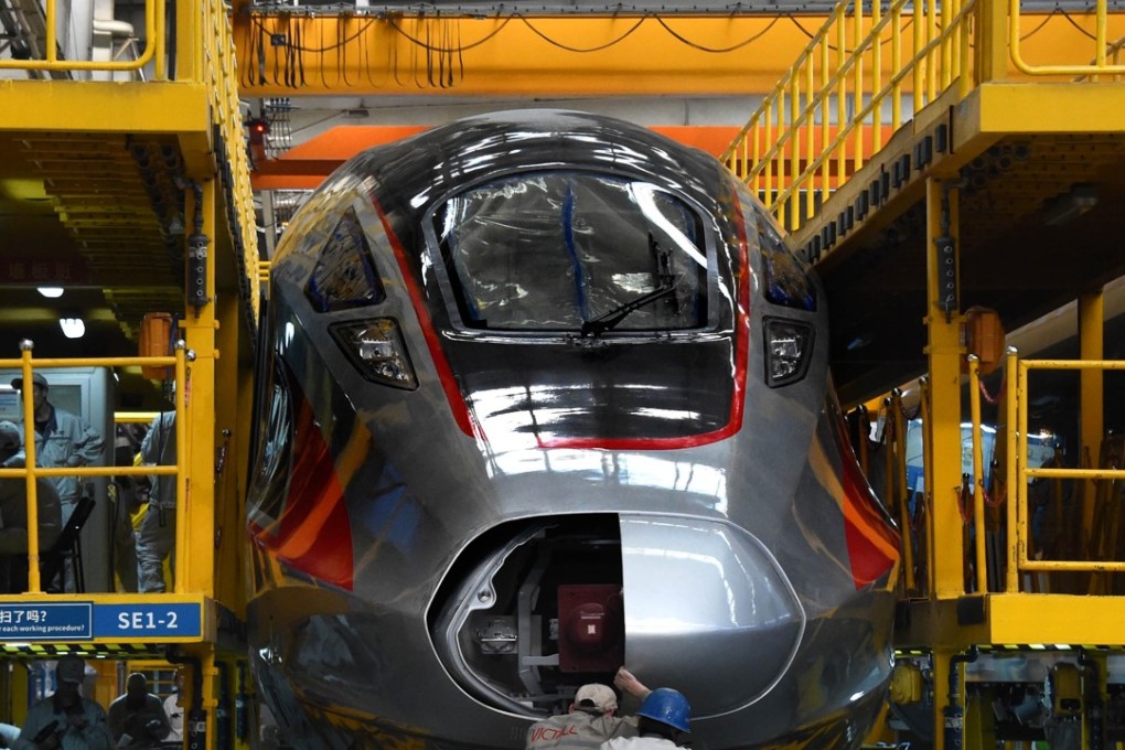 Workers assemble a Fuxing bullet train at a factory in Qingdao, in Shandong province, on May 10. The “Made in China 2025” plan, which has spooked US policymakers, seeks to propel China into hi-tech dominance. Photo: Xinhua