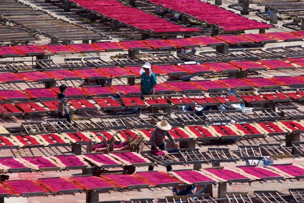 Workers spread incense sticks to dry after dyeing them at a workshop in Quanzhou in Fujian province, in March. China’s central bank cut the reserve requirement ratio in a bid to encourage lending to small and medium-sized enterprises. Photo: Reuters