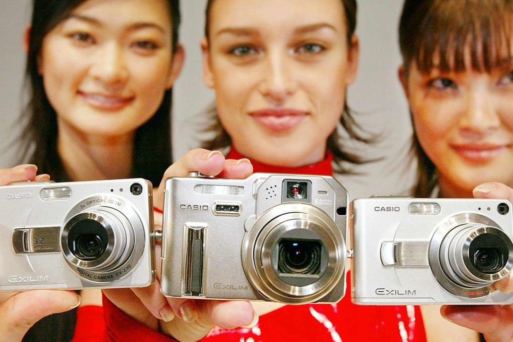 Models display Casio Computers’ Exilim digital cameras. The company, which has diversified into cameras and watches, is synonymous in the popular imagination with calculators. Photo: AFP