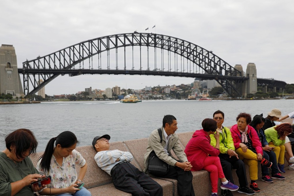 Chinese tourists near the Harbour Bridge in Sydney. Picture: Reuters