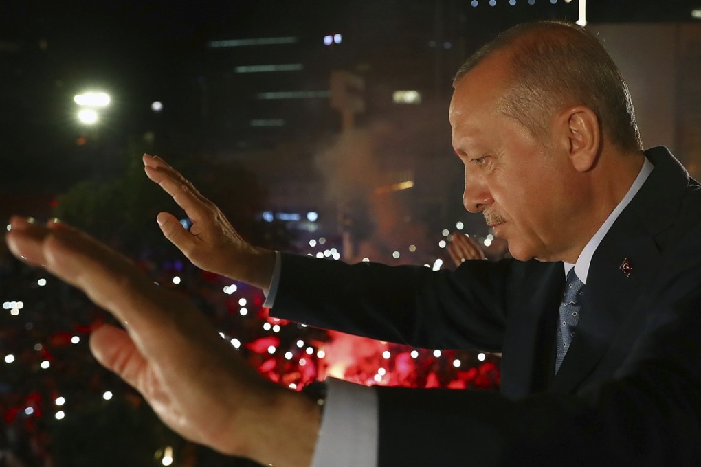 President Recep Tayyip Erdogan waves to supporters of his ruling Justice and Development Party, in the Turkish capital of Ankara on June 25. Erdogan won Turkey’s landmark election held the previous day, but critics say a new system granting the president sweeping new powers will cement what they call a one-man rule. Photo: AP