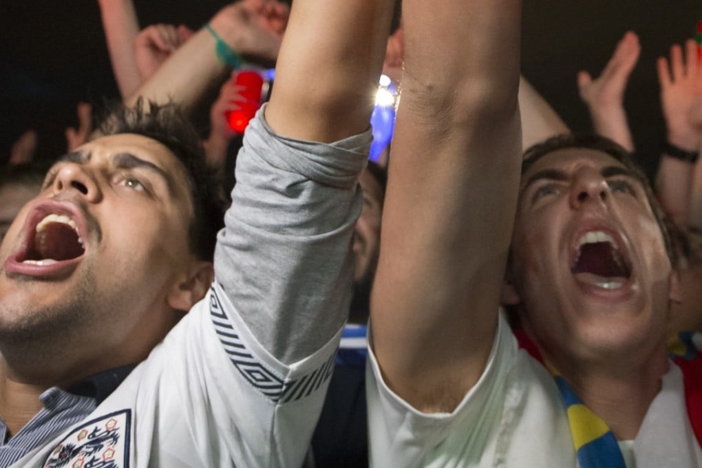 England fans celebrate the dramatic win against Colombia in a fan zone at the World Cup in Moscow, Russia. Photo: AP