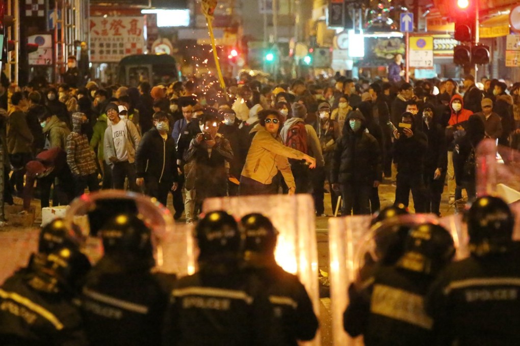 Police confront protesters in Mong Kok during a clash sparked by a crackdown on illegal hawker food stalls in February 2016. The disturbance was quickly labelled a riot. Picture: Edward Wong