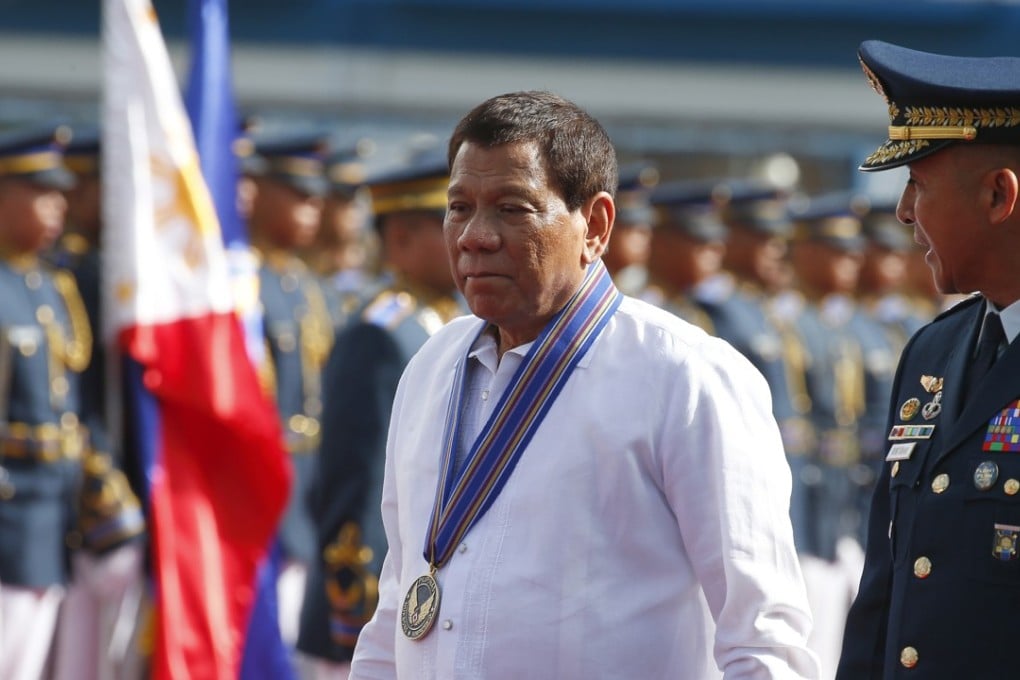 Philippine President Rodrigo Duterte reviewing the troops this month in Manila. Duterte’s anti-corruption campaign has created a revolving door of officials. Photo: AP