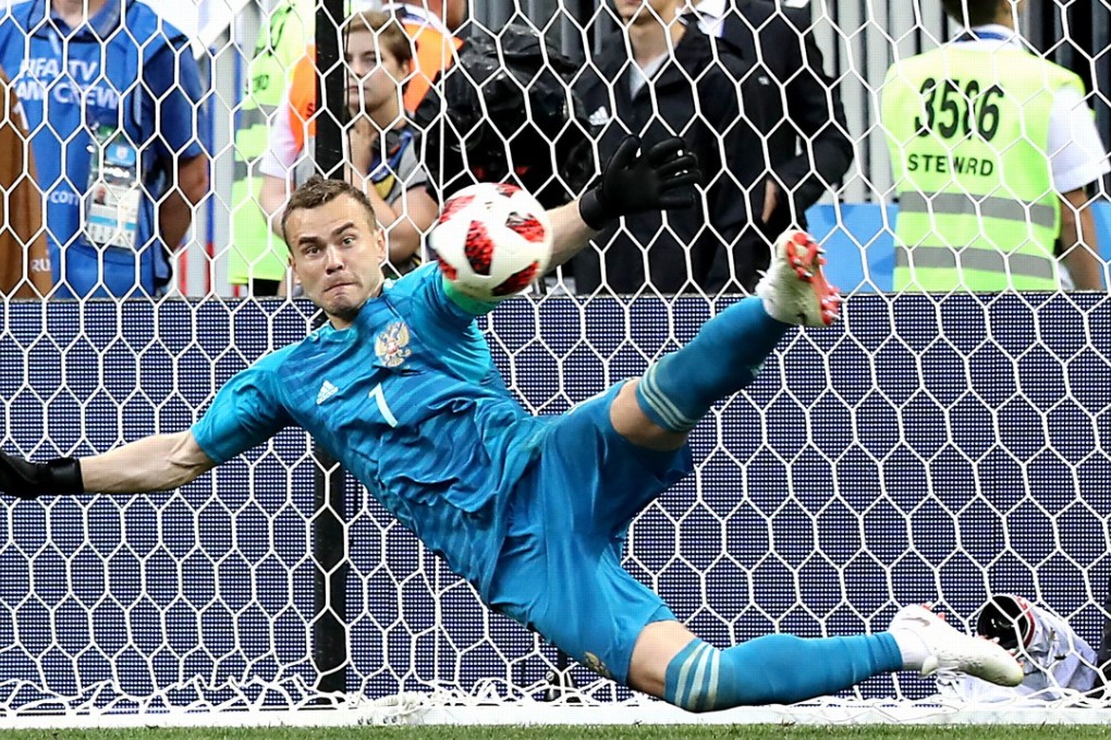 Russia’s Igor Akinfeev saves a penalty against Spain. He is available at €5.0 million in World Cup fantasy football. Photo: EPA