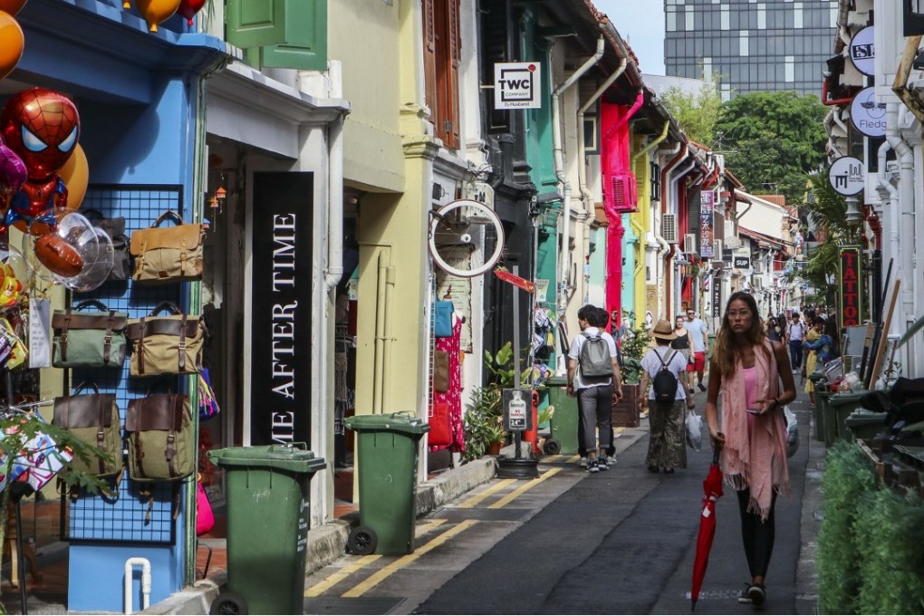 Tourists walking on Haji Lane in the Kampong Glam neighbourhood in Singapore. Photo: Roy Issa