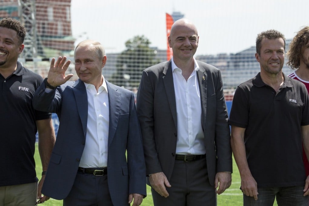 Former players Ronaldo (left), Lothar Matthaeus (second right) and Carles Puyol (right) pose with Russia’s president Vladimir Putin (second left) and Fifa president Gianni Infantino (centre). Photo: EPA