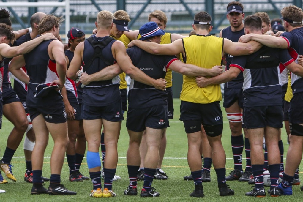 Hong Kong players form a huddle during training at Football Club.. Photo: Xiaomei Chen