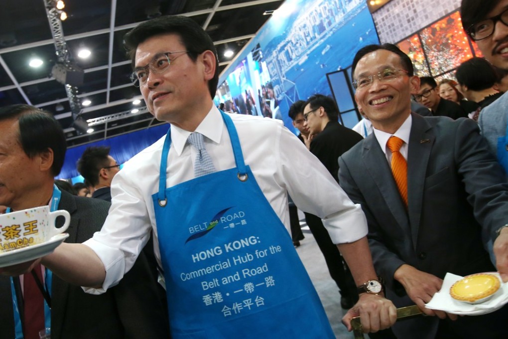 Edward Yau Tang-wah, secretary for commerce and economic development, serves Hong Kong-style milk tea during the Belt and Road Summit, at the Convention and Exhibition Centre in Wan Chai on June 28. Photo: David Wong