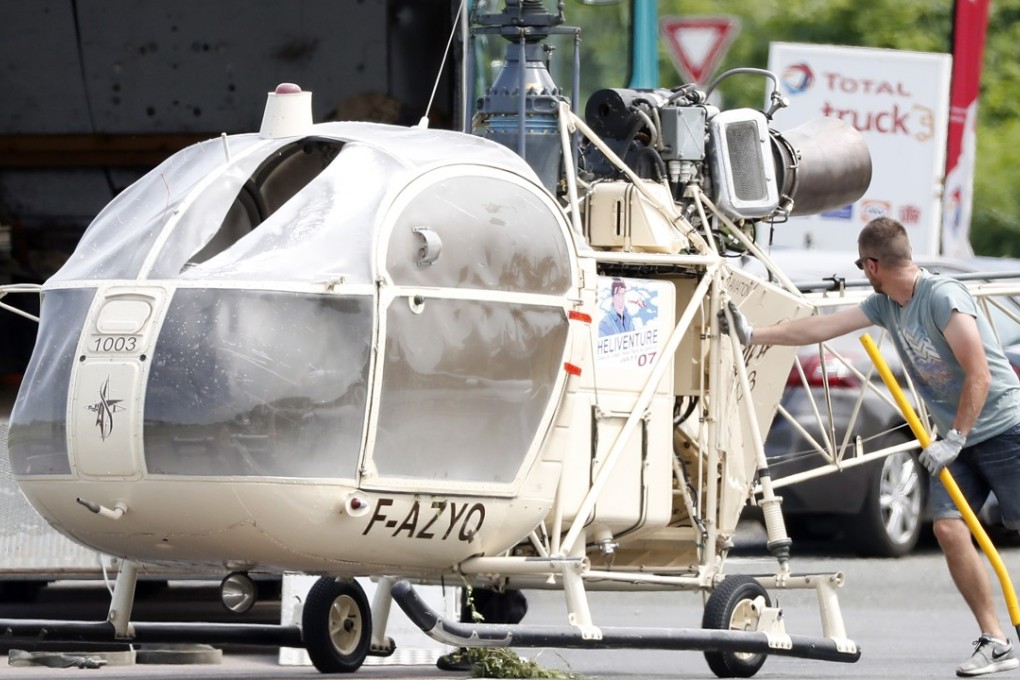 Investigators transporting an Alouette II helicopter abandoned by French prisoner Redoine Faid and accomplices after his escape from a prison north of Paris on Sunday. Photo: EPA-EFE