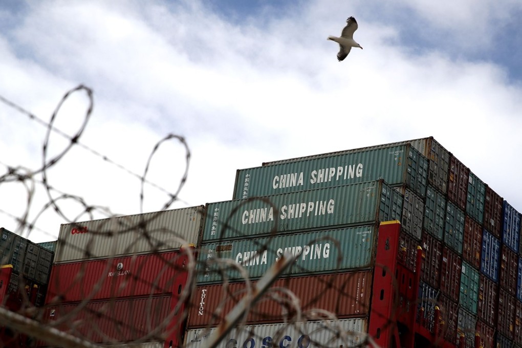 Containers on the CSCL East China Sea container ship at the Port of Oakland last month. The US and China imposed tit-for-tat tariffs on a variety of goods in the first shot in a trade war. Photo: AFP