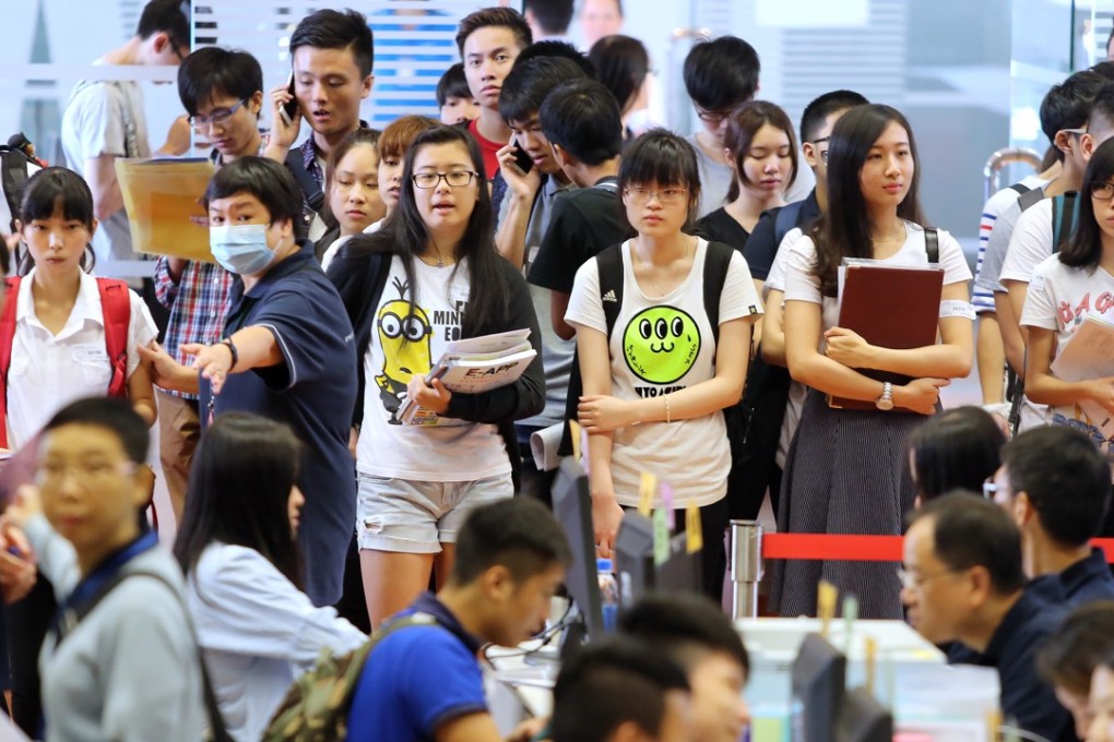Students queue up with their DSE results at the Haking Wong campus of the Institute of Vocational Education, in Cheung Sha Wan in July 2015. Sub-degree programmes are an option for students who do not manage to secure a place at a UGC-funded university. Photo: Sam Tsang