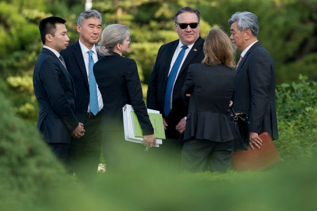 US Secretary of State Mike Pompeo, wearing sunglasses, conferring with aides after meeting with Kim Yong-chol in Pyongyang, North Korea, on Friday. Photo: AFP