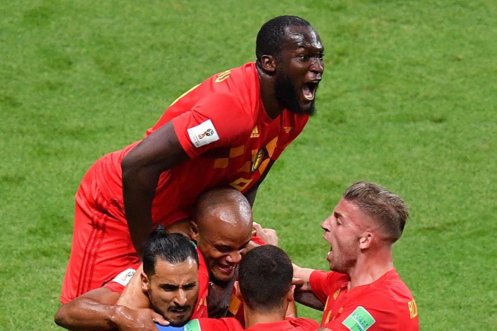 Belgium forward Romelu Lukaku jumps over teammates to celebrate Brazil’s own goal during the 2018 World Cup quarter-final football match between Brazil and Belgium. Photo: AFP