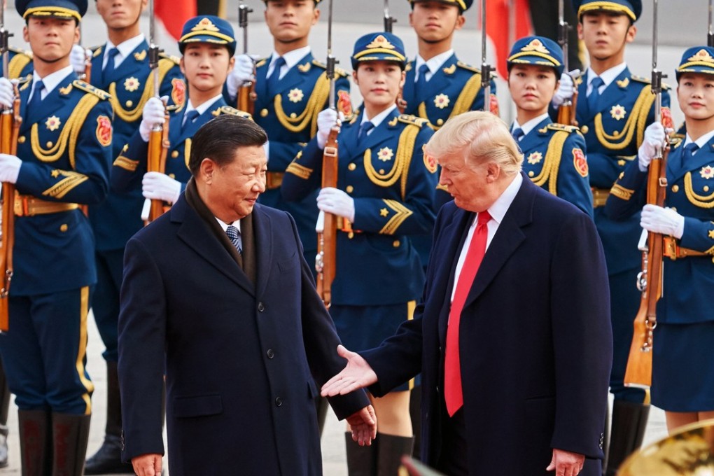 Chinese President Xi Jinping and US President Donald Trump shake hands on November 9, 2017. A slew of Wall Street experts have been called in to explain Trump and his administration to Chinese leaders during the ongoing trade war negotiations. Photo: Tass/Abaca Press via TNS