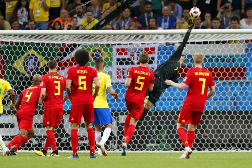 Belgium goalkeeper Thibaut Courtois makes a fine fingertip save at the death to ensure his country hold on to their lead against Brazil. Photo: EPA