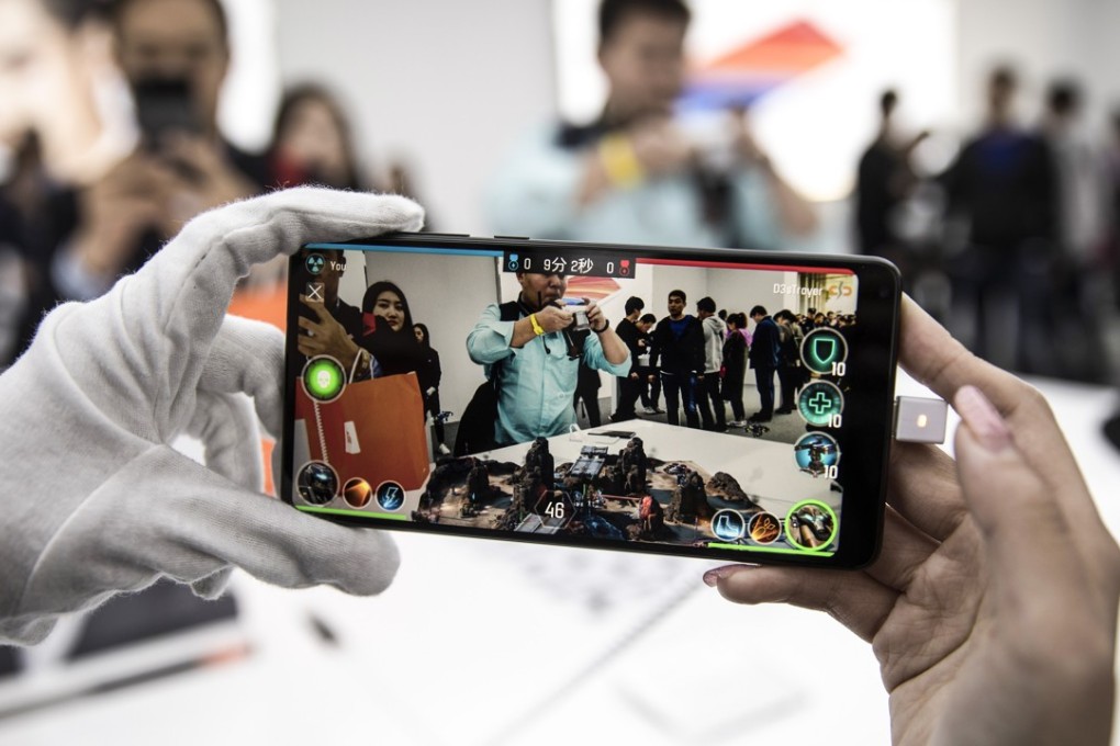 A customer tests the augmented reality function of a Xiaomi smartphone in Shanghai, China. Photo: Bloomberg