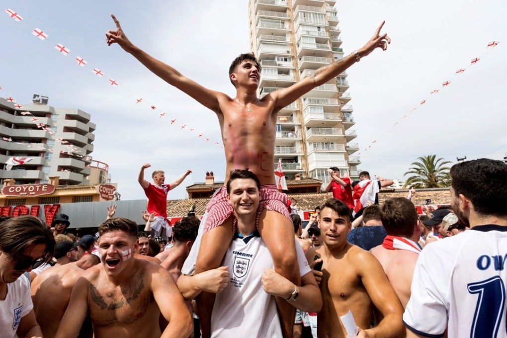 England supporters celebrate their team’s victory after the World Cup quarter-final win over Sweden. Photo: EPA
