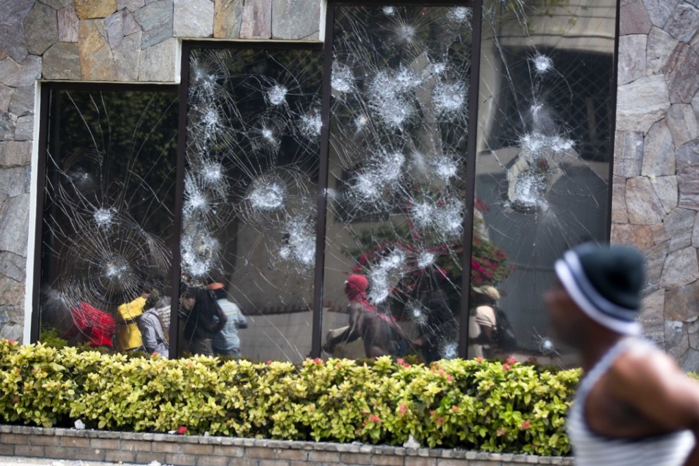 There were reports of some gunfire. A hotel was also attacked in the rioting. Photo: AP