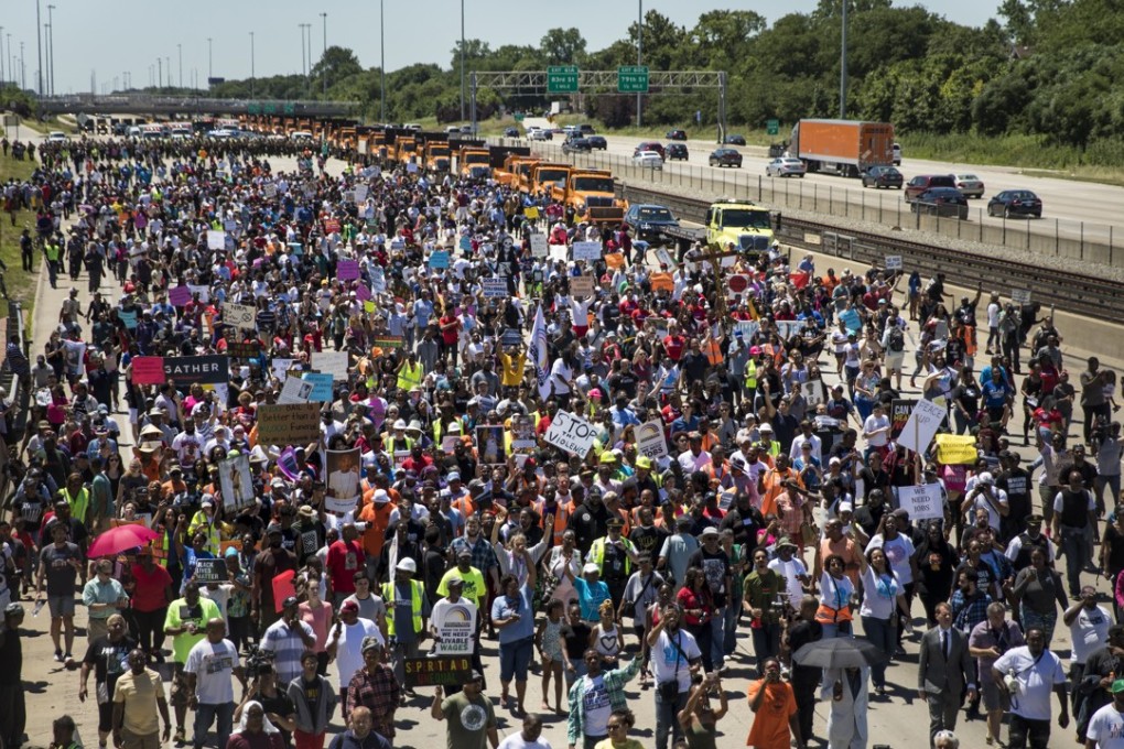 Thousands of anti-violence protesters pour into the inbound lanes of Interstate 94 in Chicago on Saturday. Photo: Chicago Sun-Times via AP