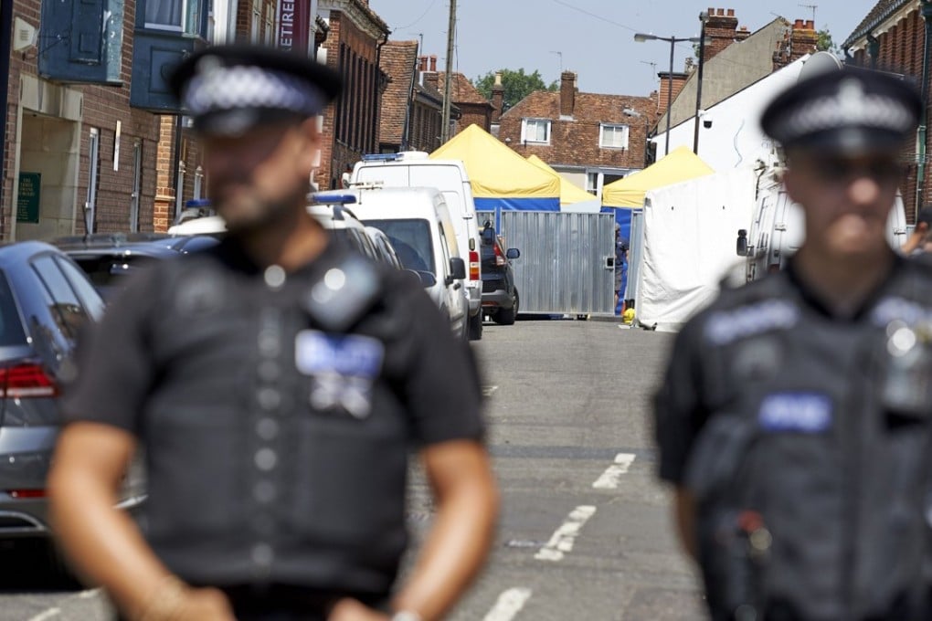 Police officers stands guard at a cordon near Rollestone Street, outside the house where Charlie Rowley and Dawn Sturgess were found suffering from Novichok poisoning. Photo: AFP