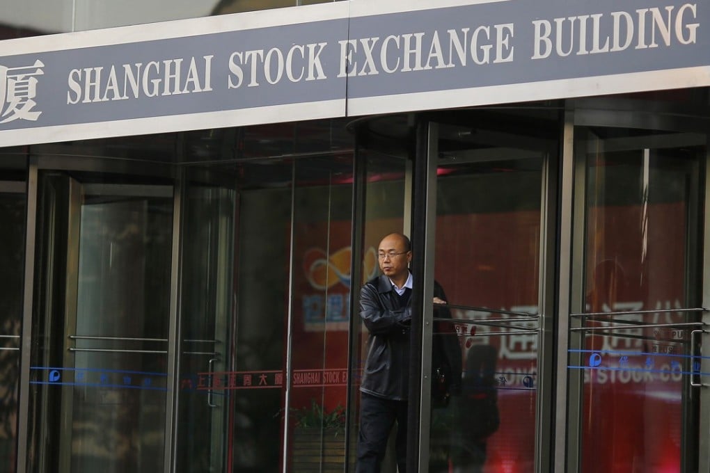 A man walks out of the Shanghai Stock Exchange building at the Pudong financial district in Shanghai in this November 17, 2014 file photo. Hong Kong's stock exchange has told investors it expects them to hit the limit of shares they can buy via its trading link with Shanghai by the end of March 2015, a development that will pressure China to lift the quota to prevent the scheme grinding to a near halt. REUTERS/Carlos Barria/Files (CHINA - Tags: BUSINESS)