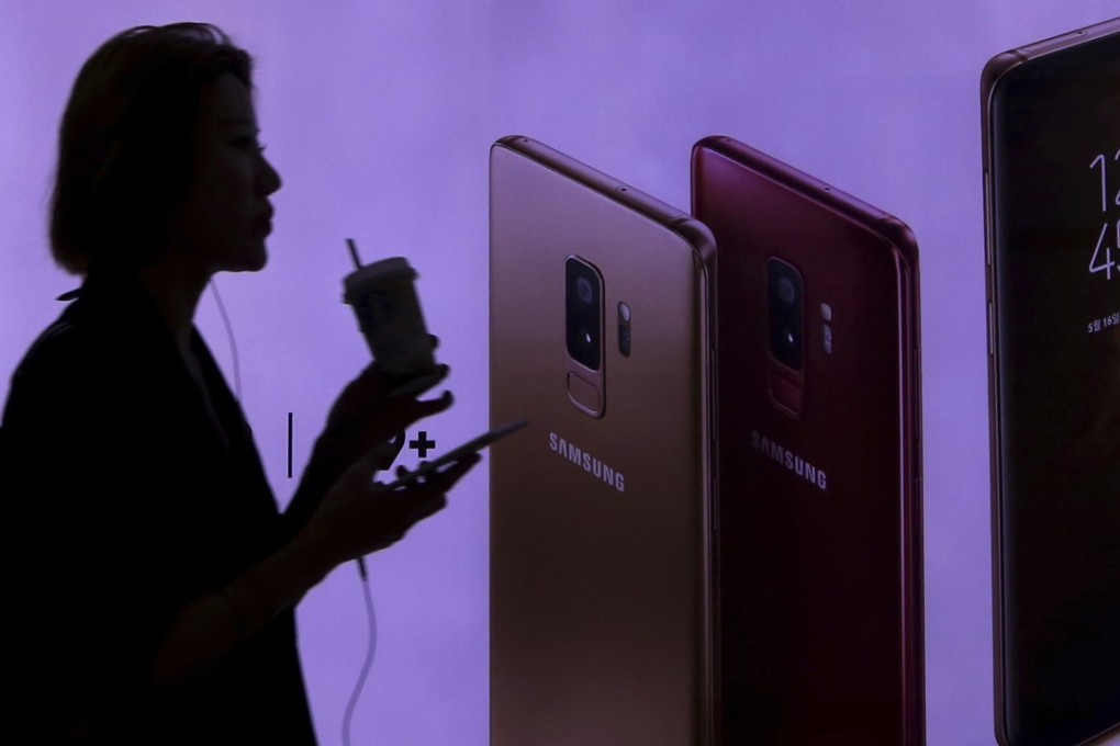 A woman passes by an advertisement of Samsung Electronics' Galaxy S9 and S9+ smartphone at a subway station in Seoul, South Korea. Samsung has built what it claims as the world’s largest mobile phone factory on the outskirts of the Indian capital of New Delhi. Photo: AP