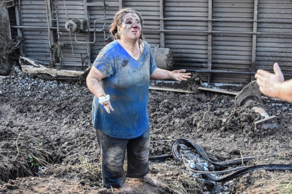 An injured passenger awaits help in the immediate aftermath of a train derailment in Turkey’s Tekirdag region on Sunday. Photo: Agence France-Presse