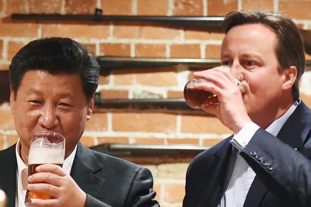 British Prime Minister David Cameron shares a pint with Chinese President Xi Jinping during Xi’s visit to the UK in 2015. Plans for Donald Trump’s upcoming visit to the UK have brought up nasty memories of crackdowns on anti-Xi protesters from around this time. Photo: pool via EPA