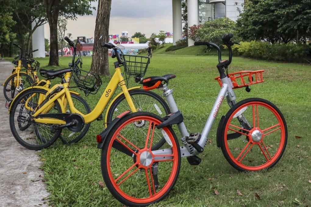 Bikes from Ofo (rear) and Mobike (front) seen in Singapore. Photo: SCMP/Roy Issa