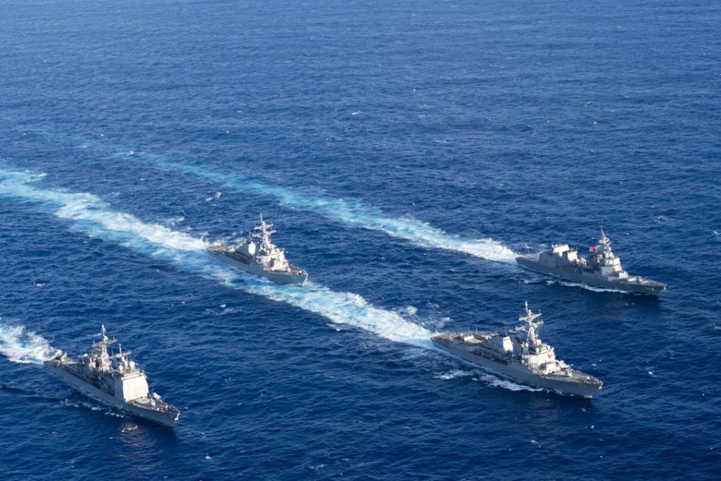 The destroyer USS Mustin, shown leading a formation in March’s MultiSail 2018 military exercises in the Philippine Sea, was one of two US destroyers that sailed through the Taiwan Strait this weekend. Photo: US Navy