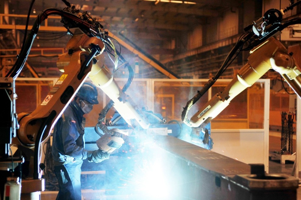 An employee works on a pumper truck production line in Hebei province. China’s factory price inflation rose to a six-month high in June. Photo: AFP