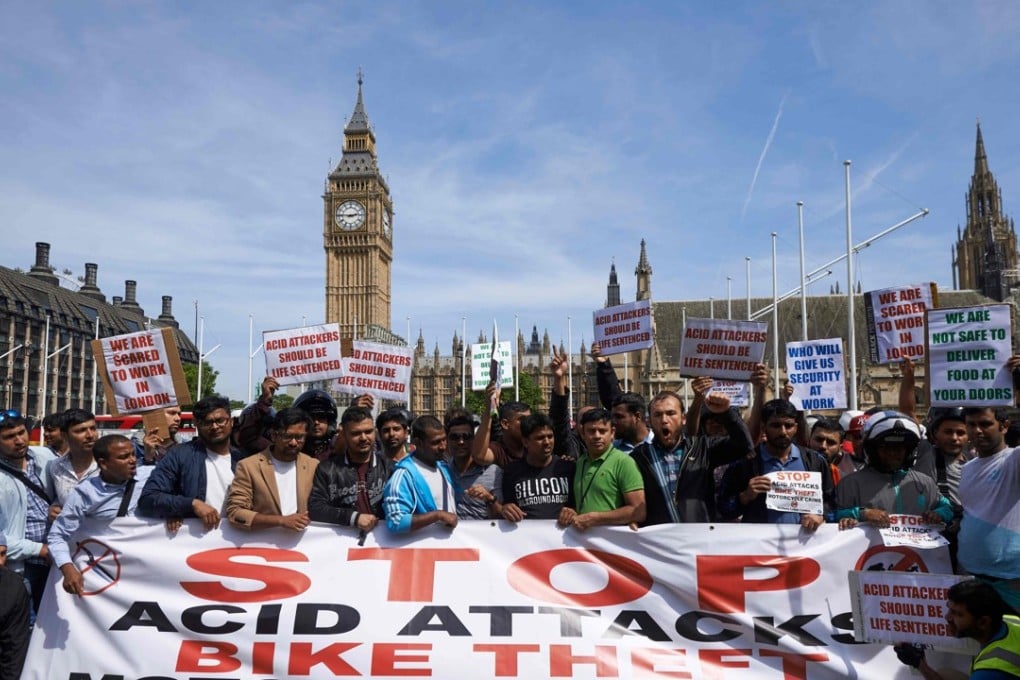 Motorcycle delivery drivers and cyclists take part in a demonstration in London in July 2017 after a spate of acid attacks. Photo: AFP