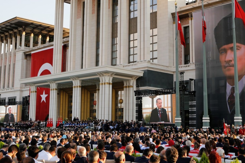 Turkish President Recep Tayyip Erdogan delivers his inaugural speech during a ceremony at the Presidential Palace in Ankara on Monday. Overlooking the scene is a portrait of Mustafa Kemal Ataturk, who founded the republic. Photo: Xinhua