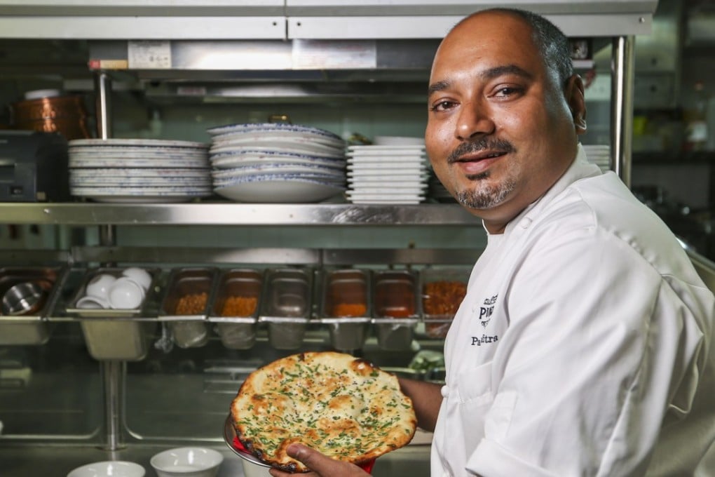 Chef Palash Mitra shows off his naan. Photo: Xiaomei Chen