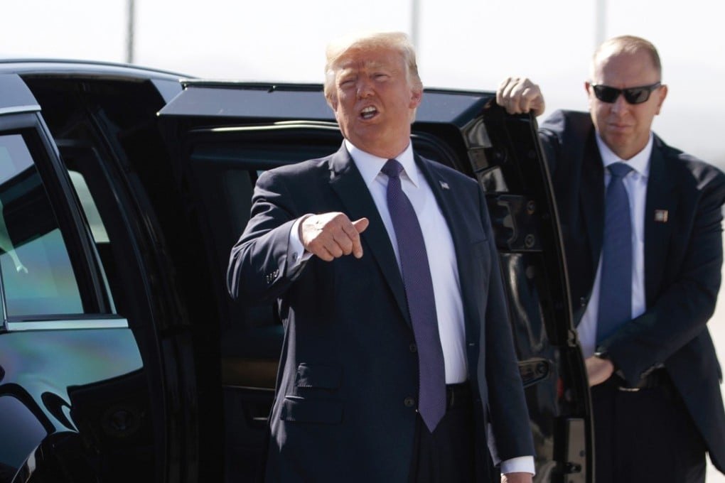 A Secret Service agent holds a limousine door open for US President Donald Trump at Las Vegas McCarran International Airport in this file photo. Photo: AP