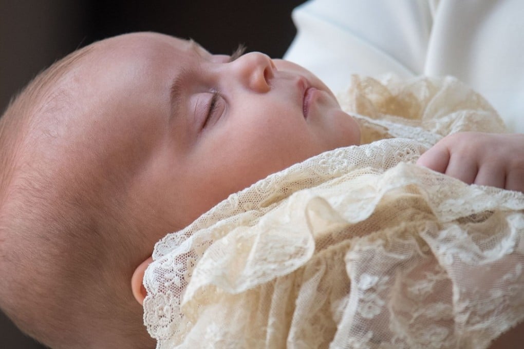 Britain's Prince Louis of Cambridge is carried by his mother, Kate, Duchess of Cambridge, on their arrival for his christening service on Monday at the Chapel Royal, St James's Palace, London. Photo: Pool via AFP