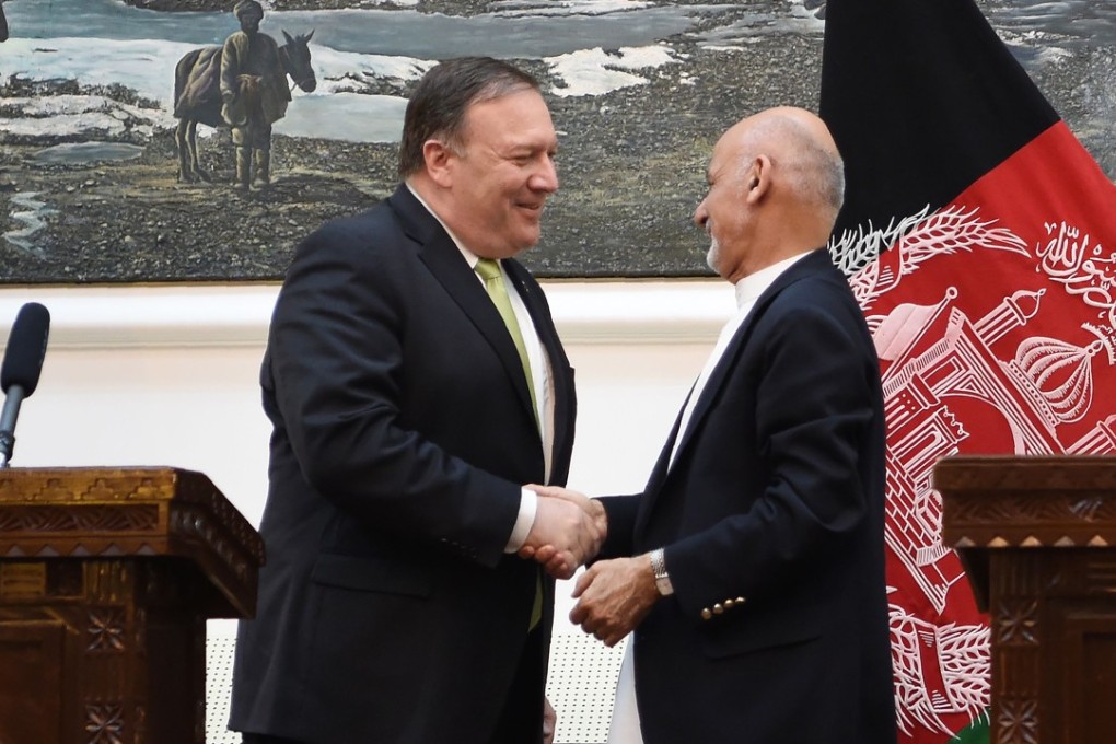 US Secretary of State Mike Pompeo shakes hands with Afghan President Ashraf Ghani after a press conference on Monday at the presidential palace in Kabul, Afghanistan. Photo: AFP