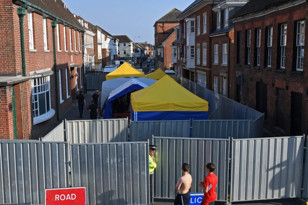 Police barriers block a road in Amesbury as investigators work at a site linked to the poisoning of a couple with the nerve agent novichok. Photo: Agence France-Presse