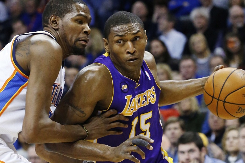 Los Angeles Lakers forward Metta World Peace (15) drives around Oklahoma City Thunder forward Kevin Durant (35) in the first quarter of an NBA basketball game in Oklahoma City, Tuesday, March 5, 2013. Photo: AP
