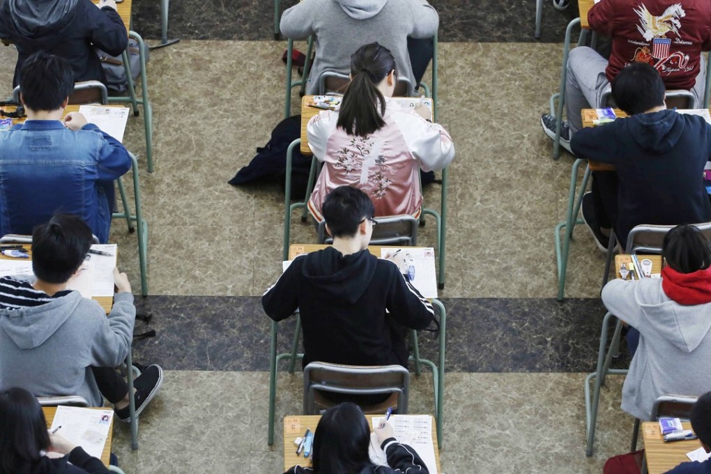 Students take the DSE examination at Kiangsu-Chekiang College in North Point. Photo: Pool