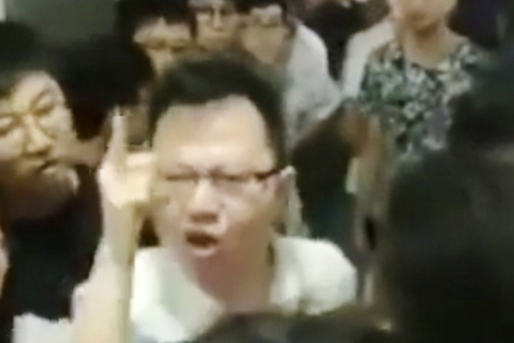 A teacher at Wuxi Institute of Technology in China shouts at students involved in a protest over a change of accommodation. Photo: Weibo