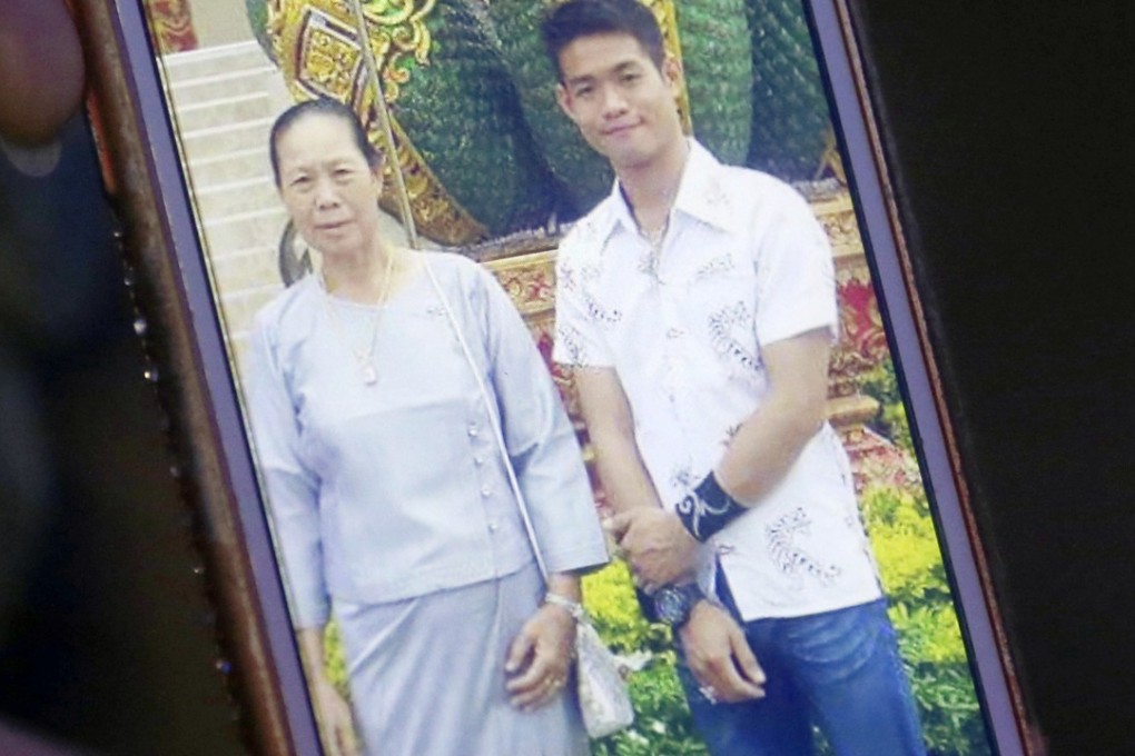 Coach Ekkapol Chantawong and his grandmother. Photo: AP