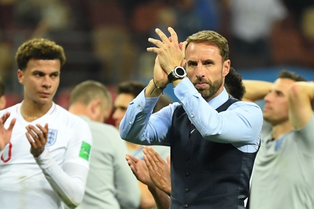 England manager Gareth Southgate (right) acknowledges the fans with his players after losing to Croatia. Photo: AFP
