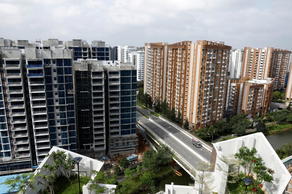 A private condominium is constructed next to a public housing estate in Singapore in February 2017. Eighty per cent of Singaporeans live in government-built housing. Photo: Reuters