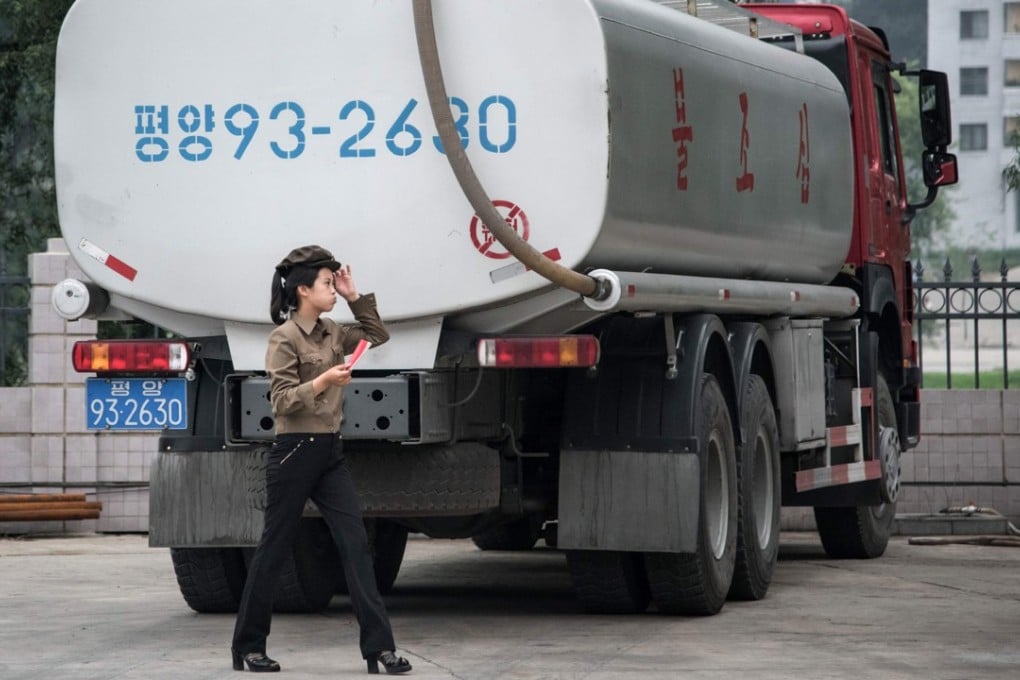 A service station worker walks past a fuel truck last year in Pyongyang, North Korea. Photo: AFP