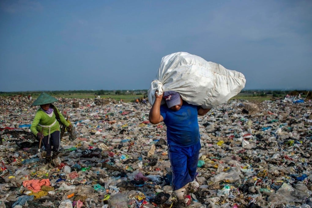 Scavengers collect waste at Sidoarjo garbage dump in East Java, Indonesia, on June 5. About eight million tonnes of plastic waste is dumped into the world’s oceans every year. Photo: AFP