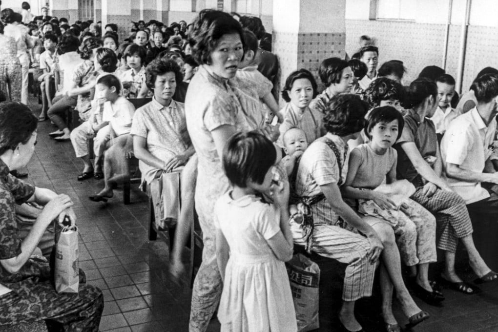 Scores of patients crowd the waiting hall of a clinic on Hong Kong Island during the influenza epidemic in July 1968. Photo: SCMP