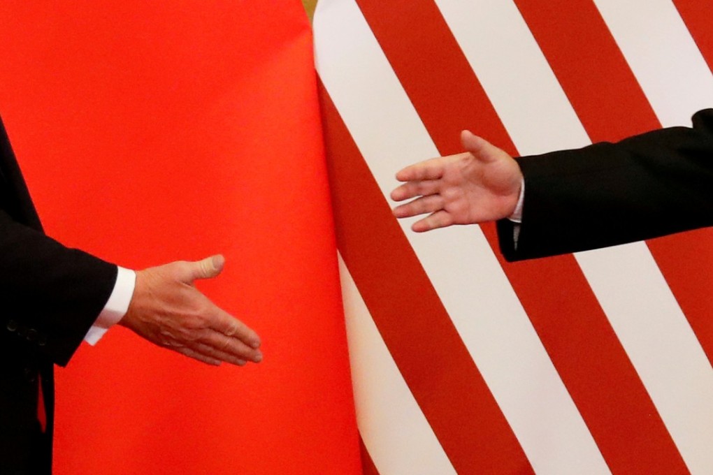 US President Donald Trump and China’s President Xi Jinping shake hands after making joint statements in Beijing last year. Photo: Reuters